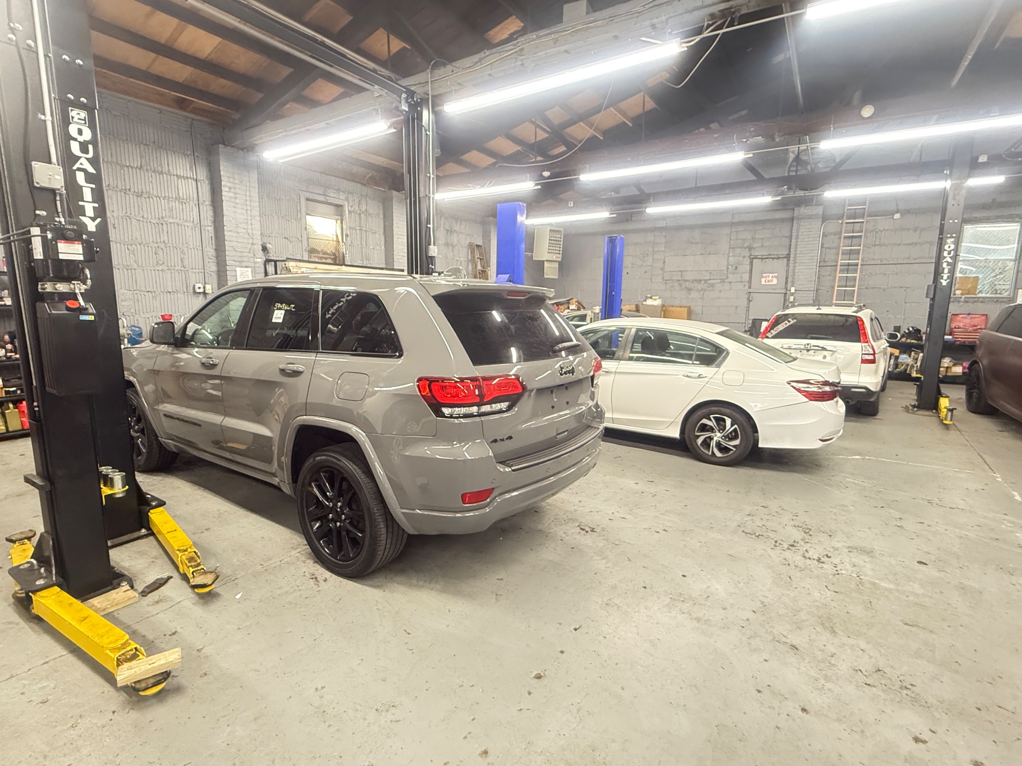 Vehicles on lifts at auto repair shop Perth Amboy